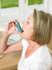 woman using asthma inhaler.jpg